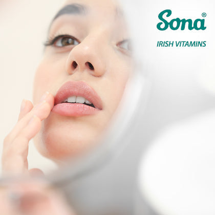 Close-up of woman touching lips, related to cold sore symptoms