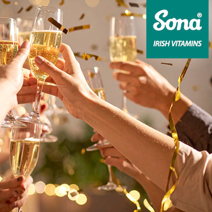 Festive gathering with drinks, representing seasonal eating and drinking habits that may impact digestion.