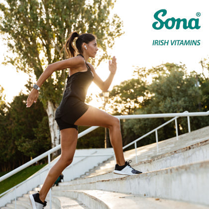 A woman running up outdoor stairs to boost energy levels, featuring Sona Irish Vitamins logo