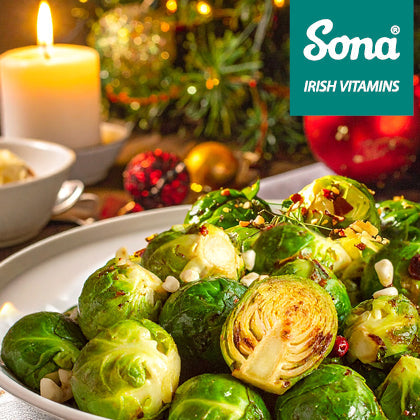Christmas meal with Brussels sprouts and vegetables, representing fibre-rich foods that support digestion during the festive season